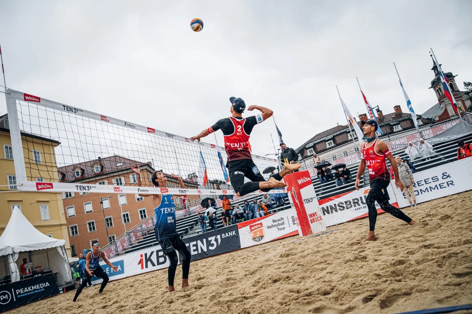 First day of beach volleyball tournament promises exciting finale despite bad weather